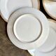 6 flat plates in gold porcelain monogrammed "F"