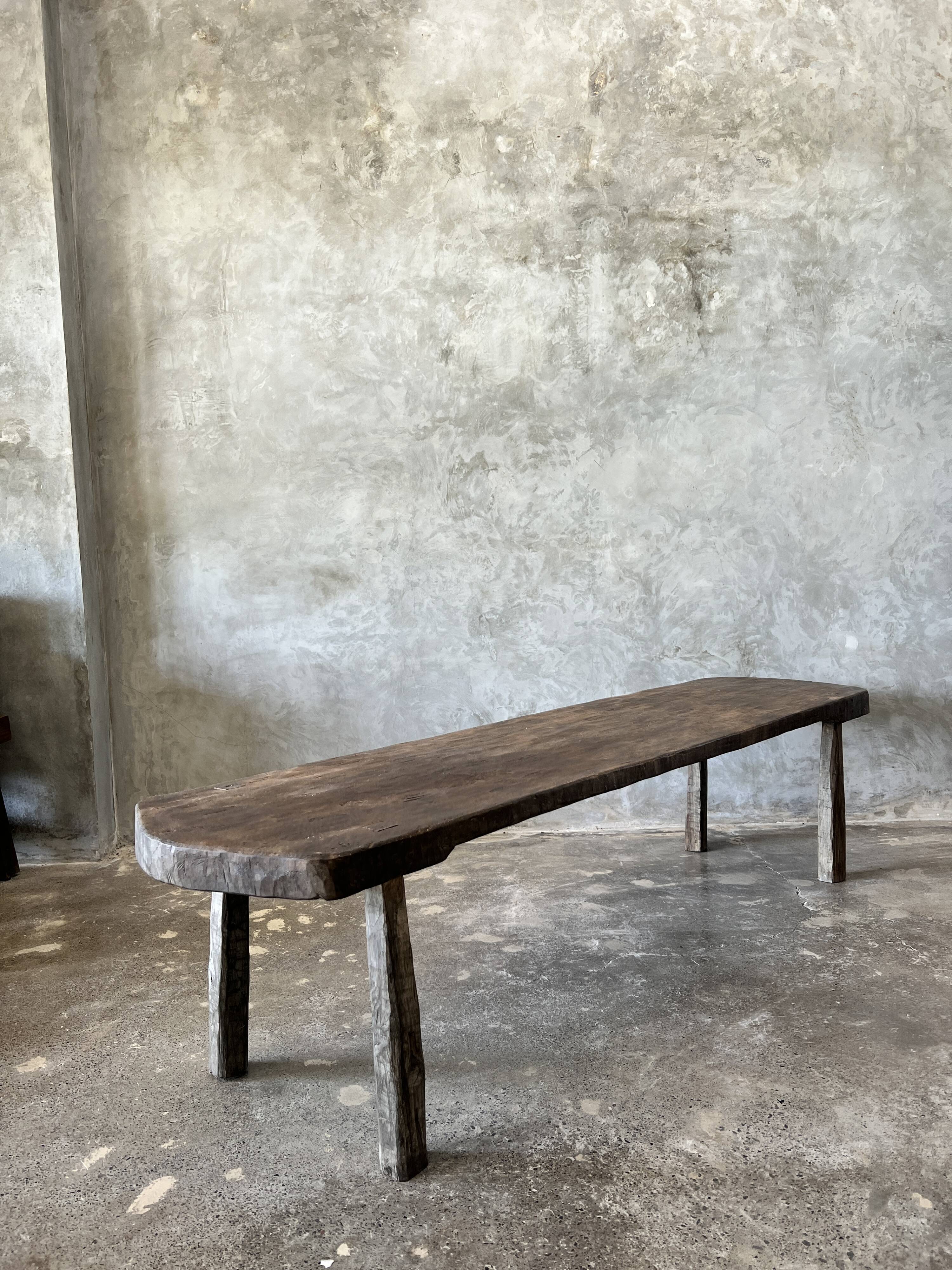 Large rounded coffee table in old Asian teak