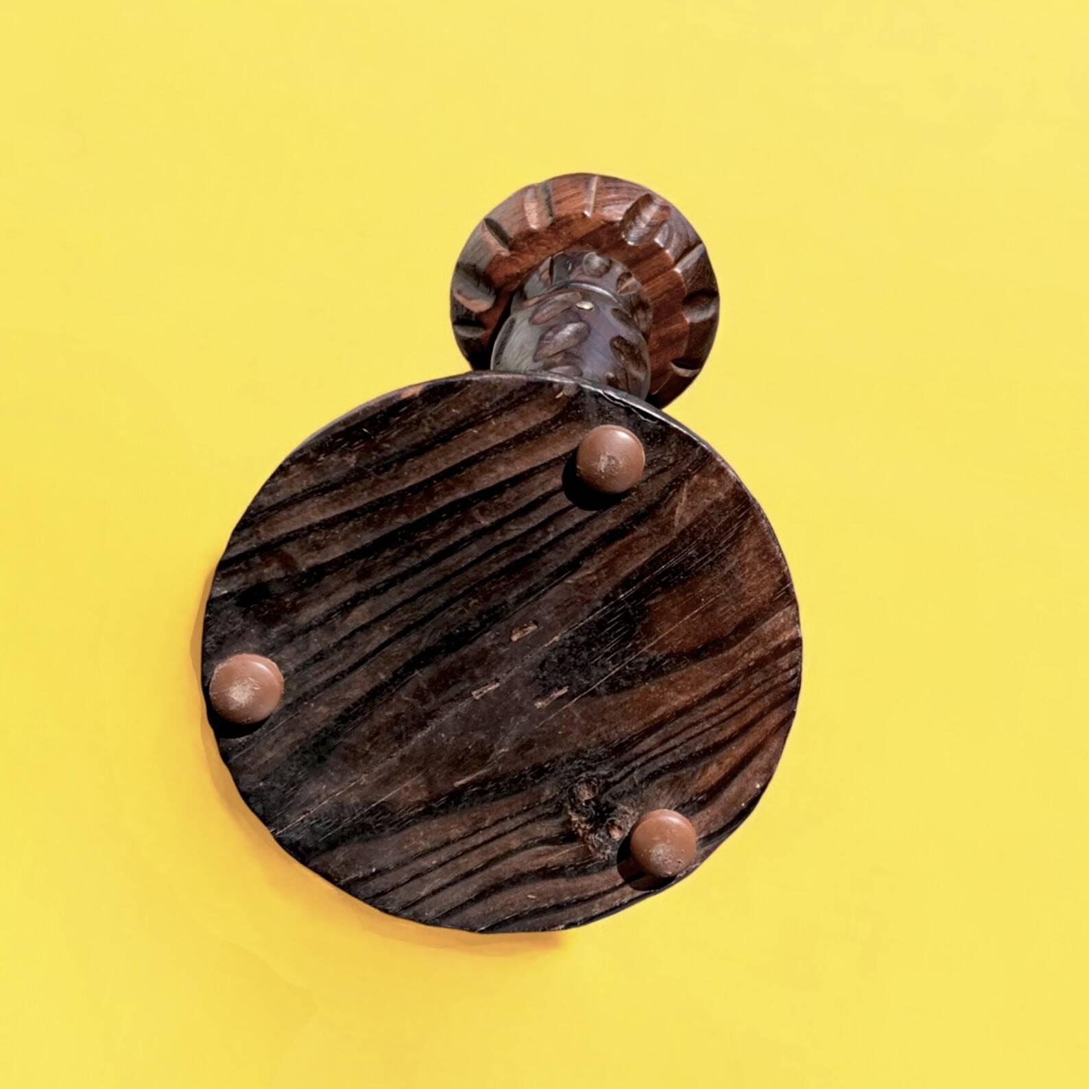 Old ashtray on carved wooden stand