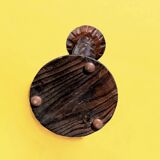 Old ashtray on carved wooden stand