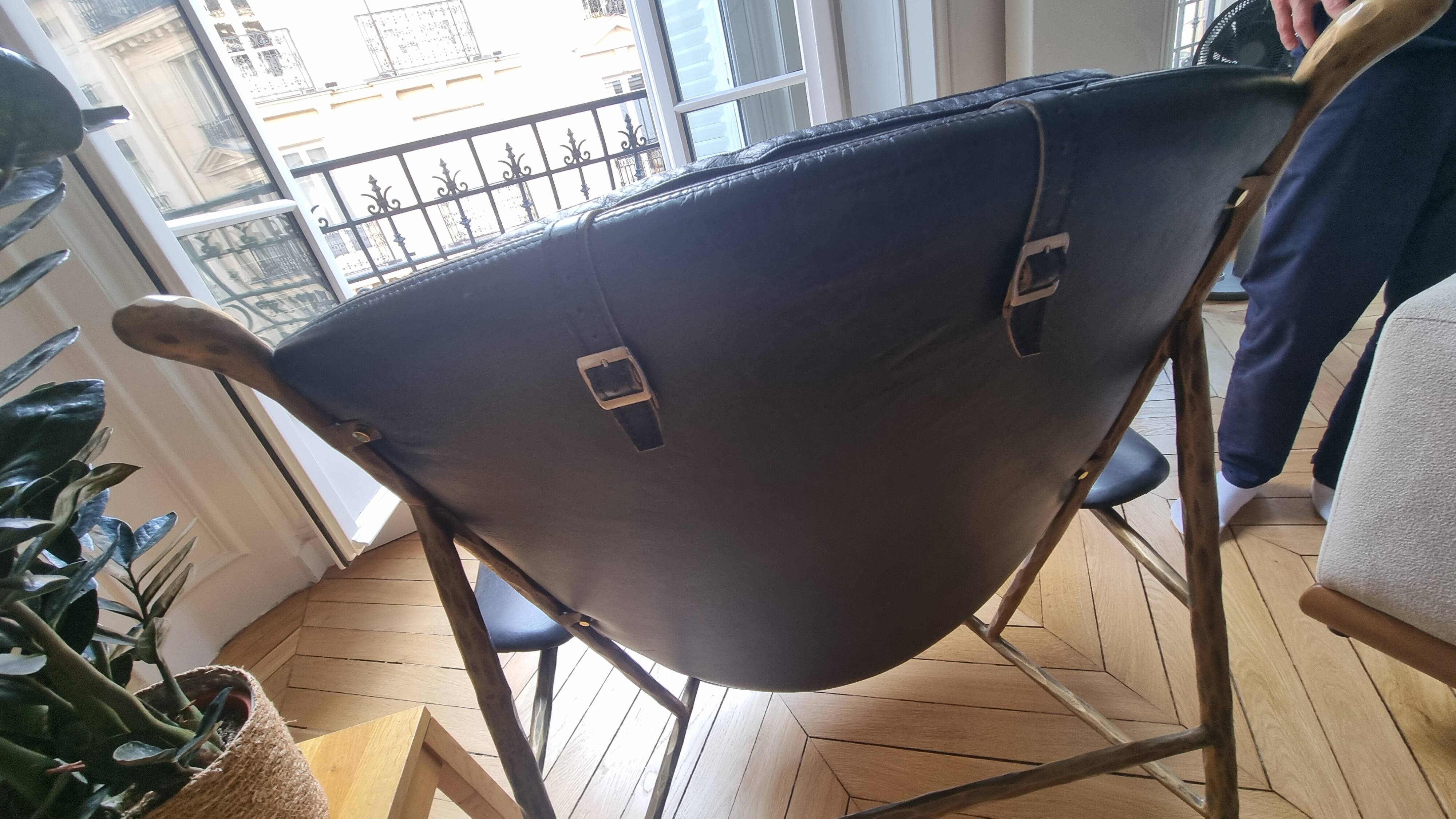 Black and golden bronze designer armchair