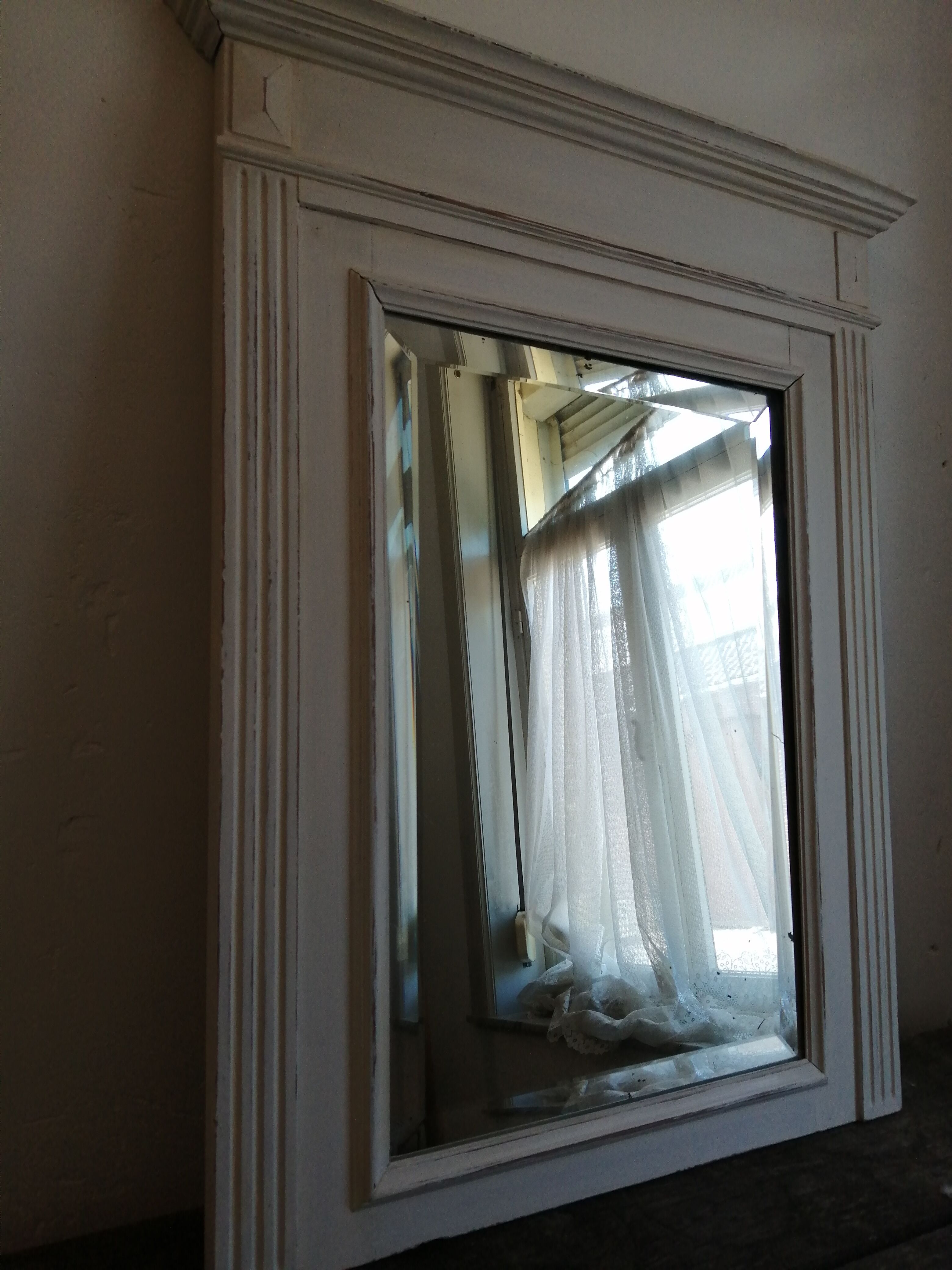 Beveled fireplace mirror
