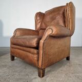 Beautiful pair of wide leather club armchairs with ears in Havana colour.