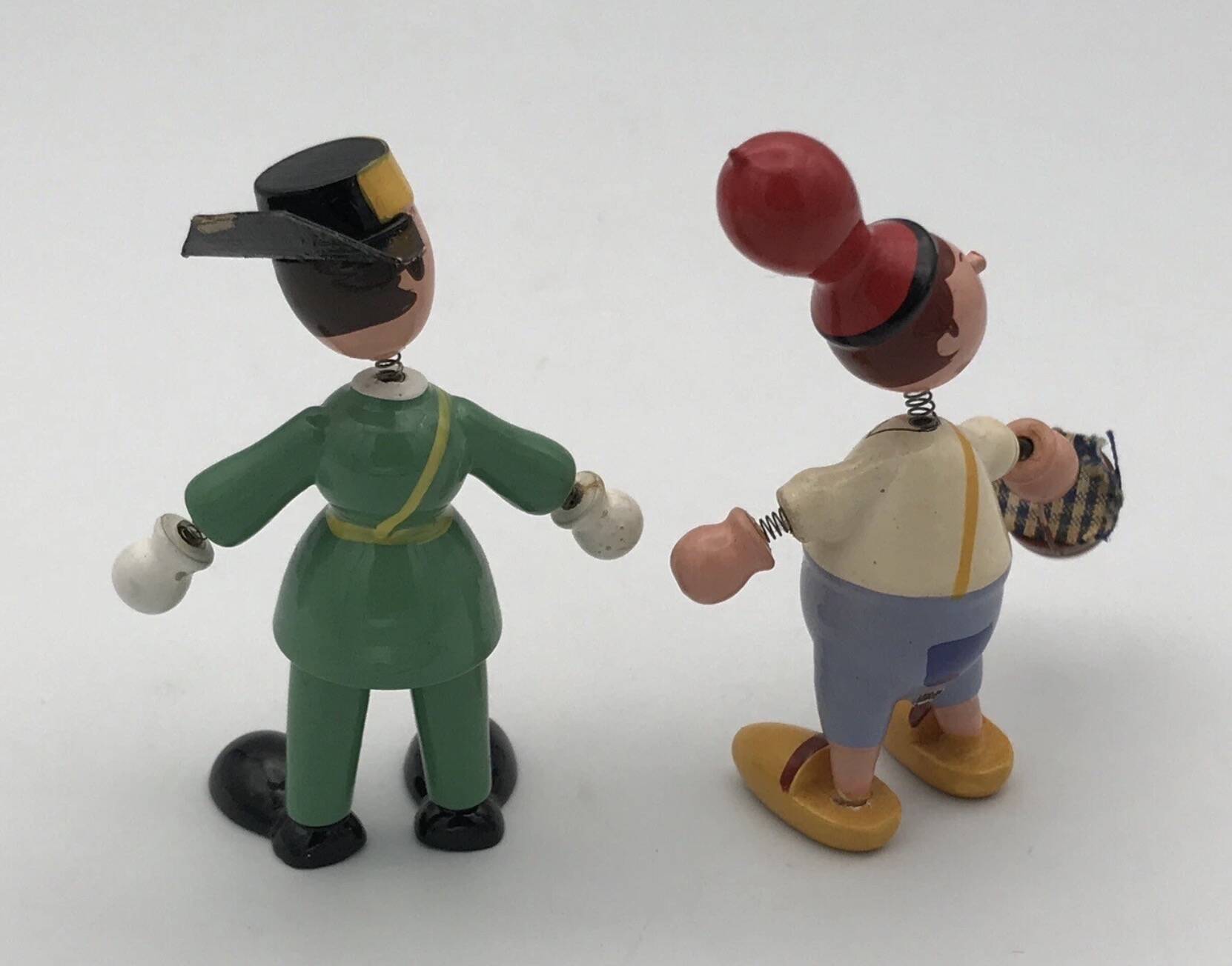 Set of 2 vintage GOULA wooden toy figurines with spring.