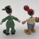 Set of 2 vintage GOULA wooden toy figurines with spring.