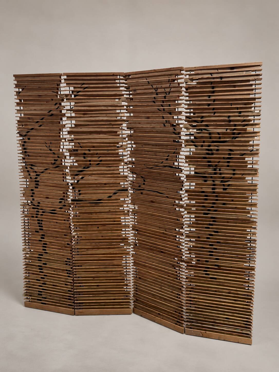 Wooden screen with slats, black plant decoration.