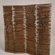 Wooden screen with slats, black plant decoration.