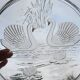 Vintage glass cake stand with swan decoration.