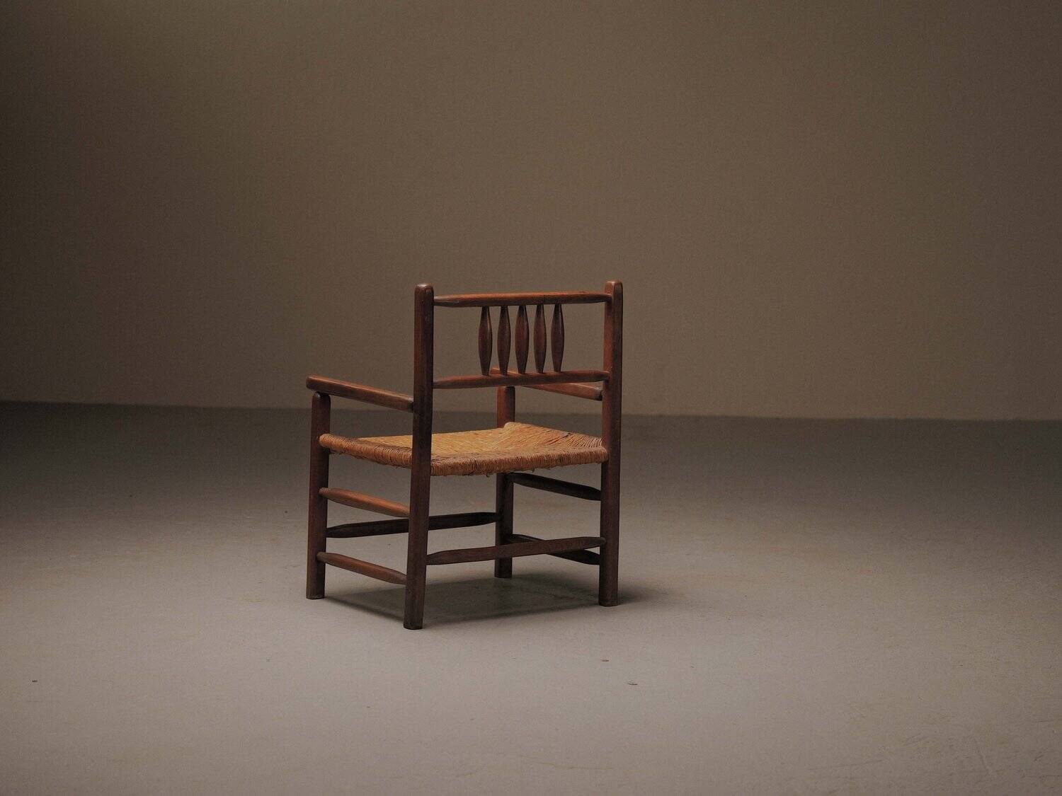 Wicker armchair in solid wood, handcrafted, France, around 1950.