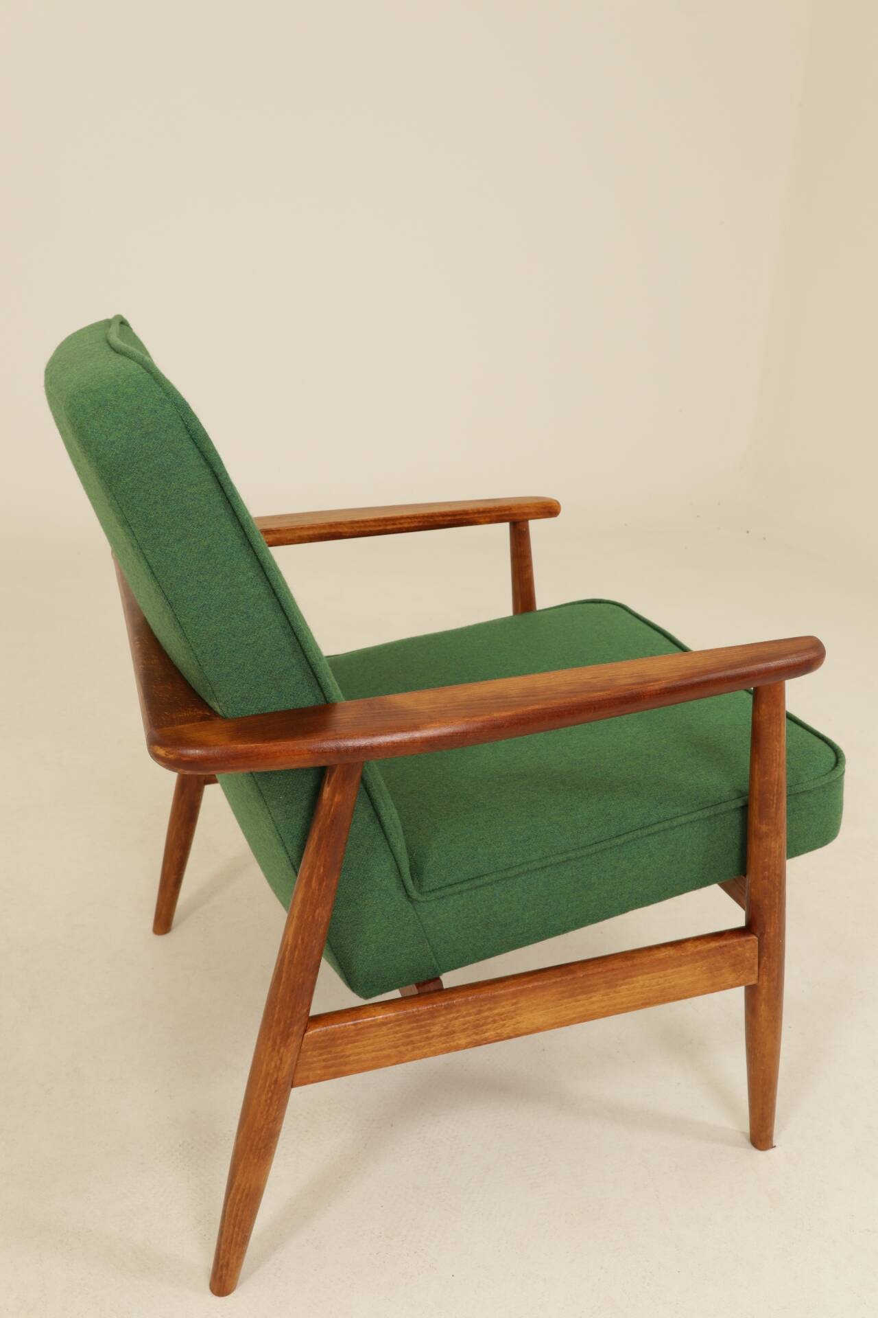 Scandinavian modern chair in green wool, vintage wooden armchair.