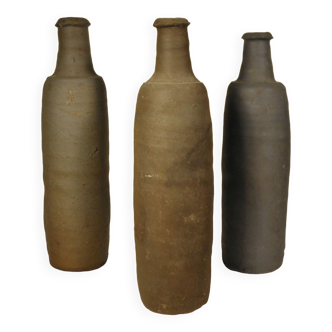 Set of three old stoneware bottles