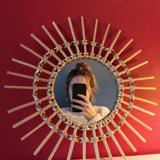 Vintage bohemian woven rattan sun mirror