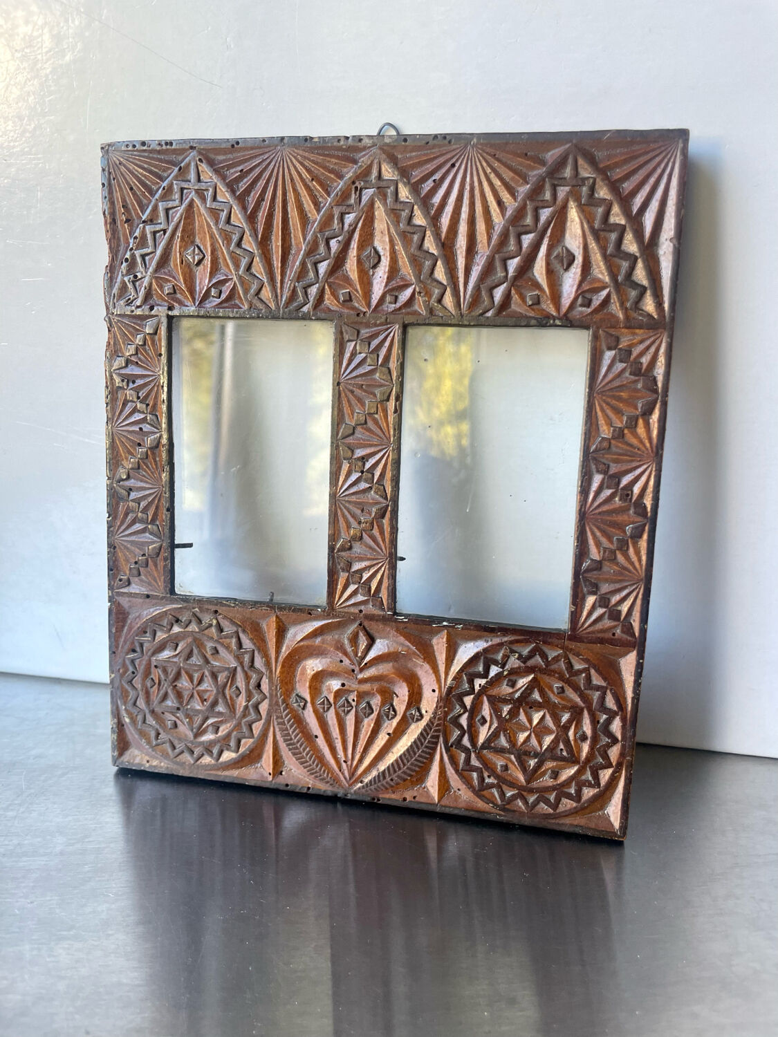 Double frame intricately carved wood