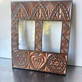 Double frame intricately carved wood