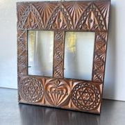 Double frame intricately carved wood