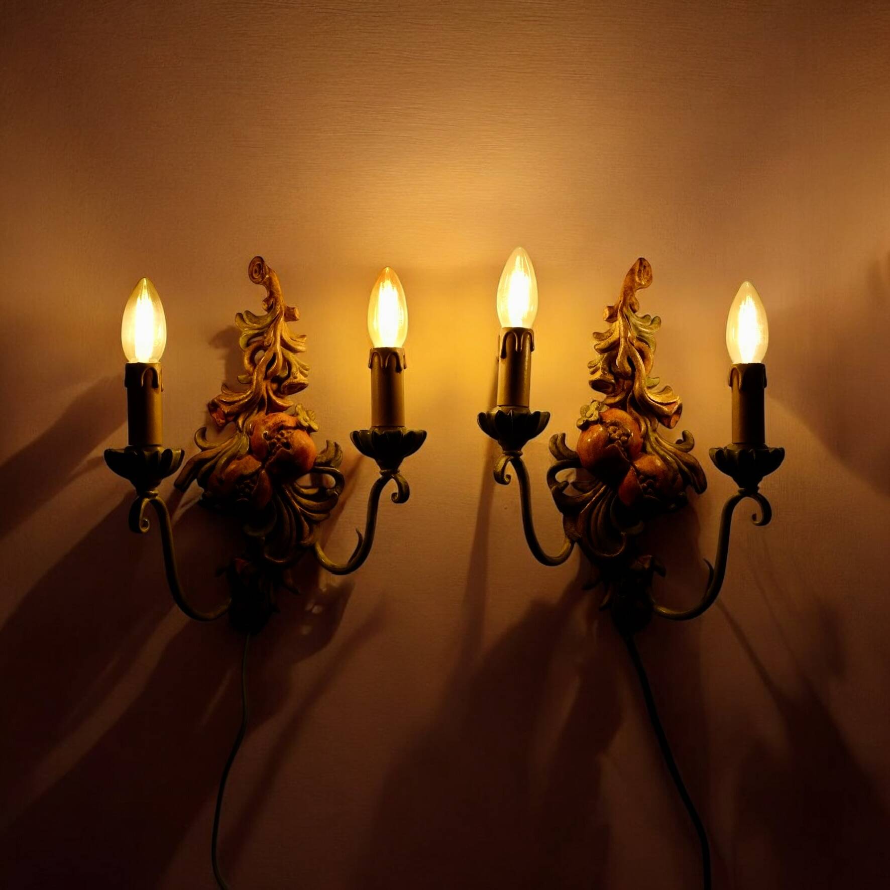 Pair of carved wood and metal sconces, Chelini FIrenze, Italy