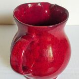 Vintage red enamel ceramic pitcher