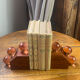 Wooden bookends and spherical glass balls