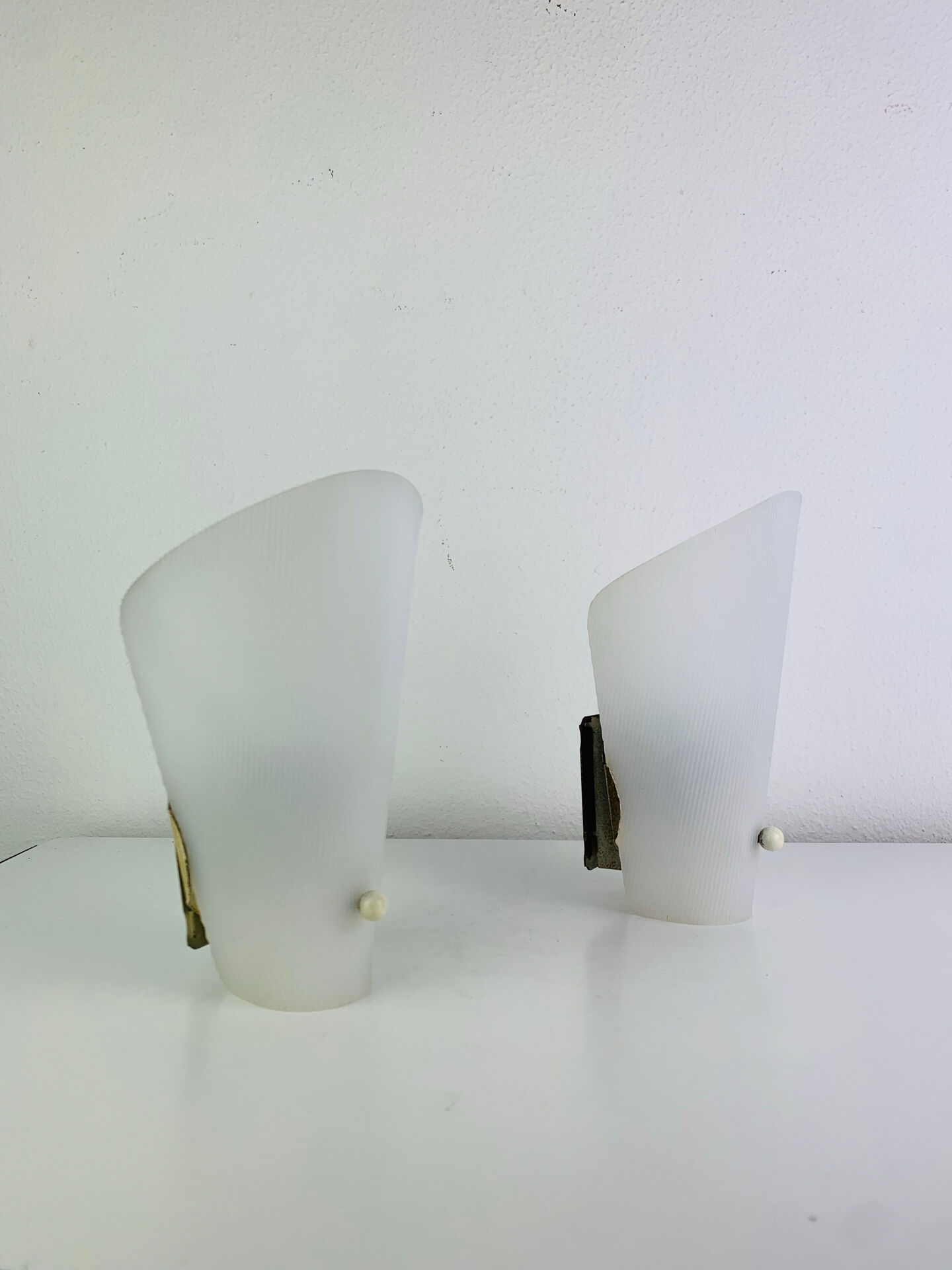 Pair of 1950s striped plastic wall lights.