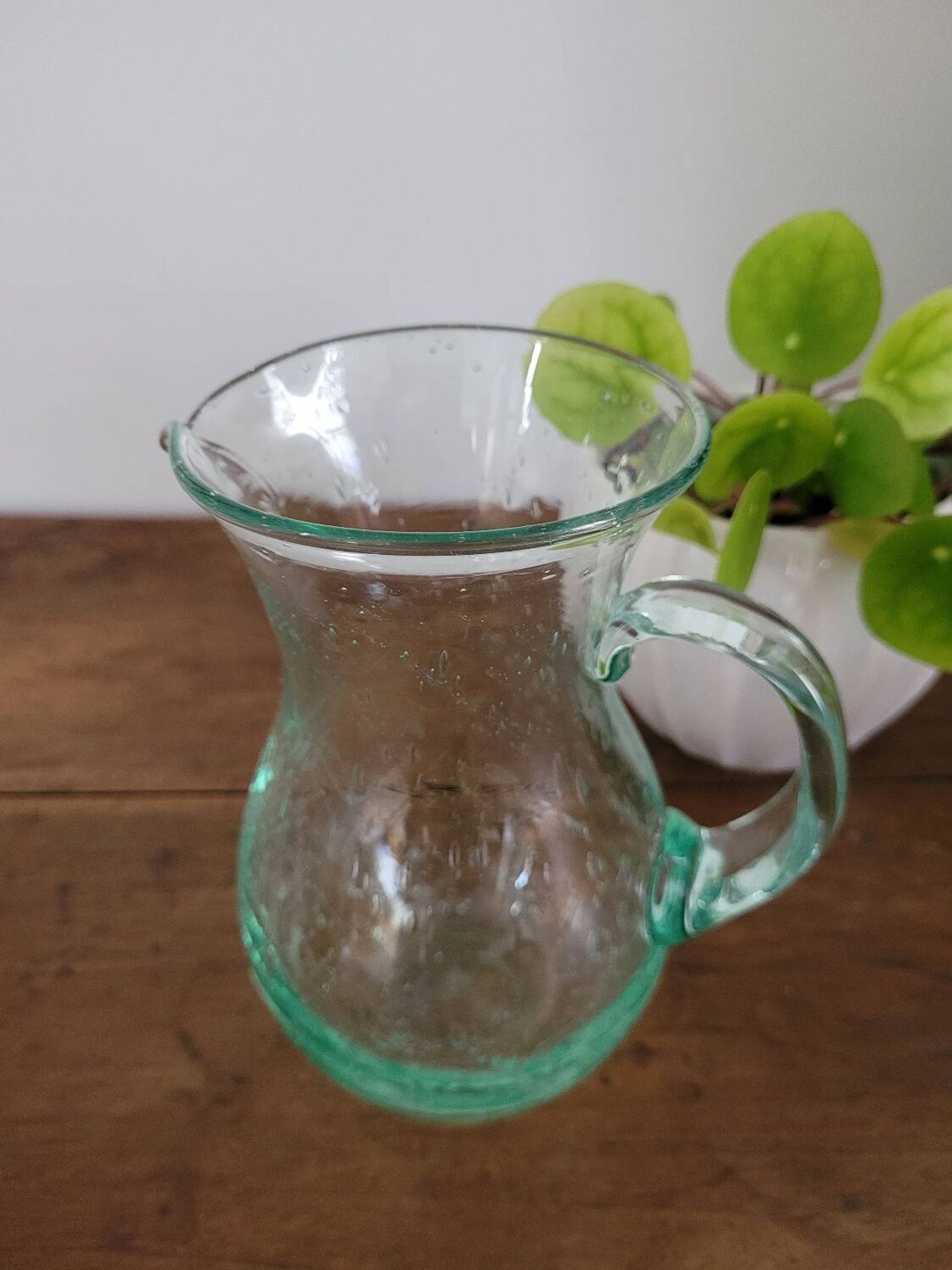 pitcher in green bubbled glass