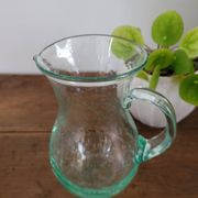 pitcher in green bubbled glass