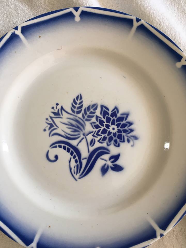 Together seven dessert plates mismatched in blue.