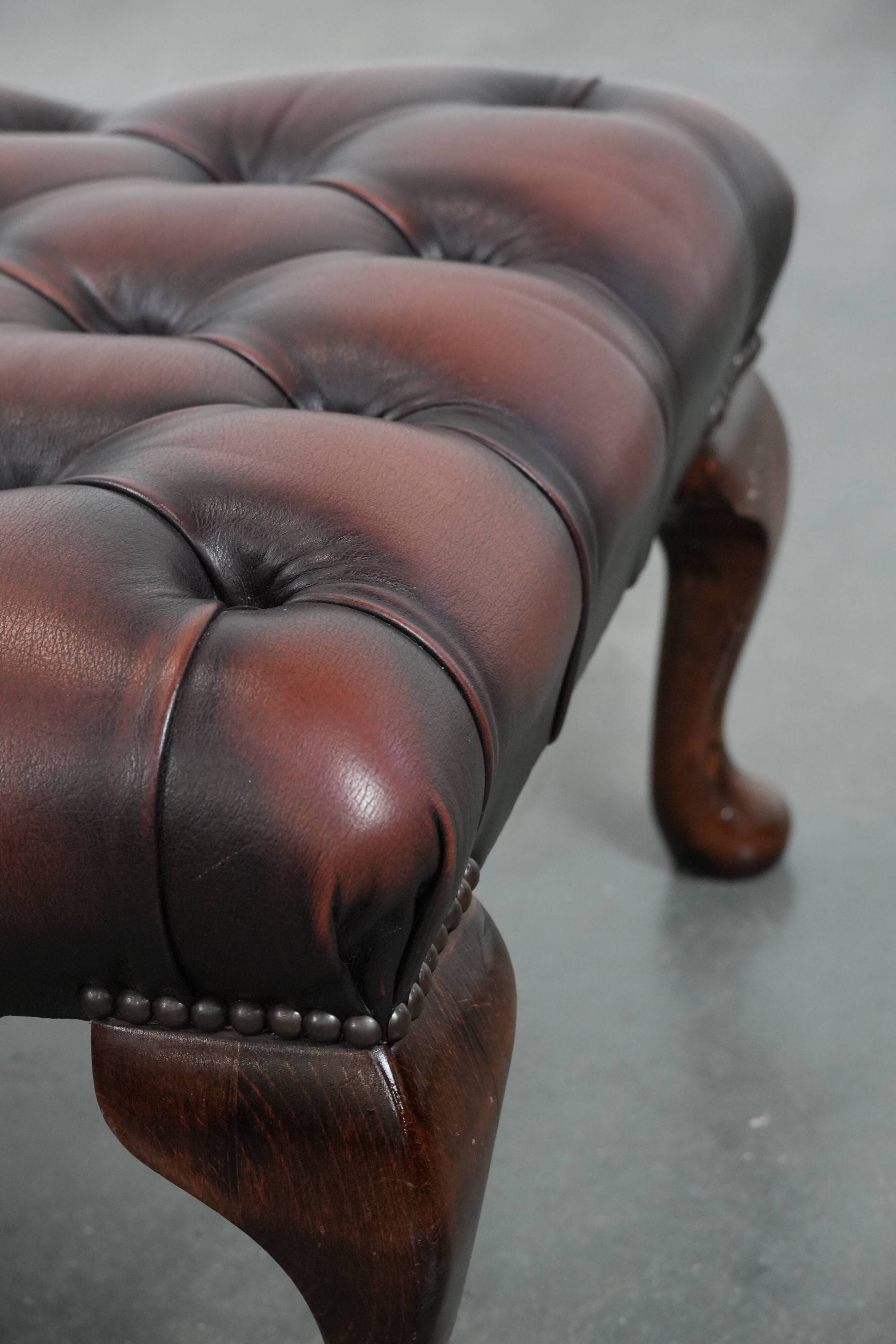 Dark brown chesterfield ottoman in cowhide leather