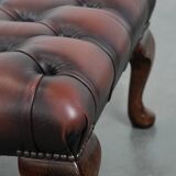 Dark brown chesterfield ottoman in cowhide leather