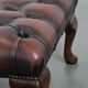 Dark brown chesterfield ottoman in cowhide leather