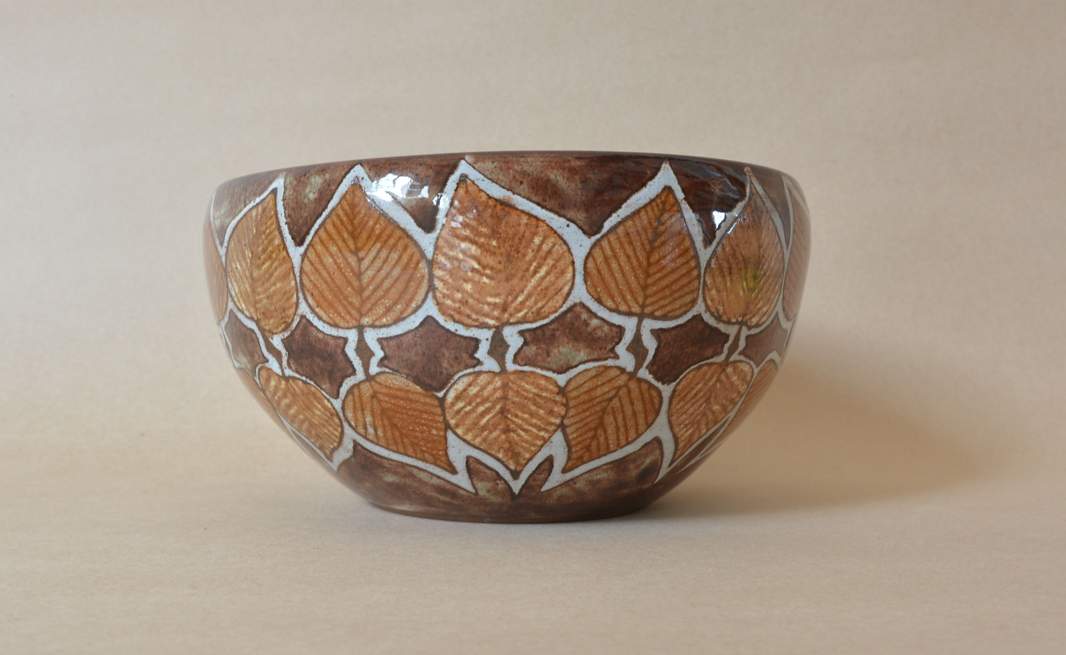 Cup with stylized leaf decoration by Jean-Claude Malarmey