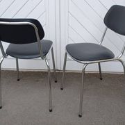 Pair of vintage faux leather and chrome chairs