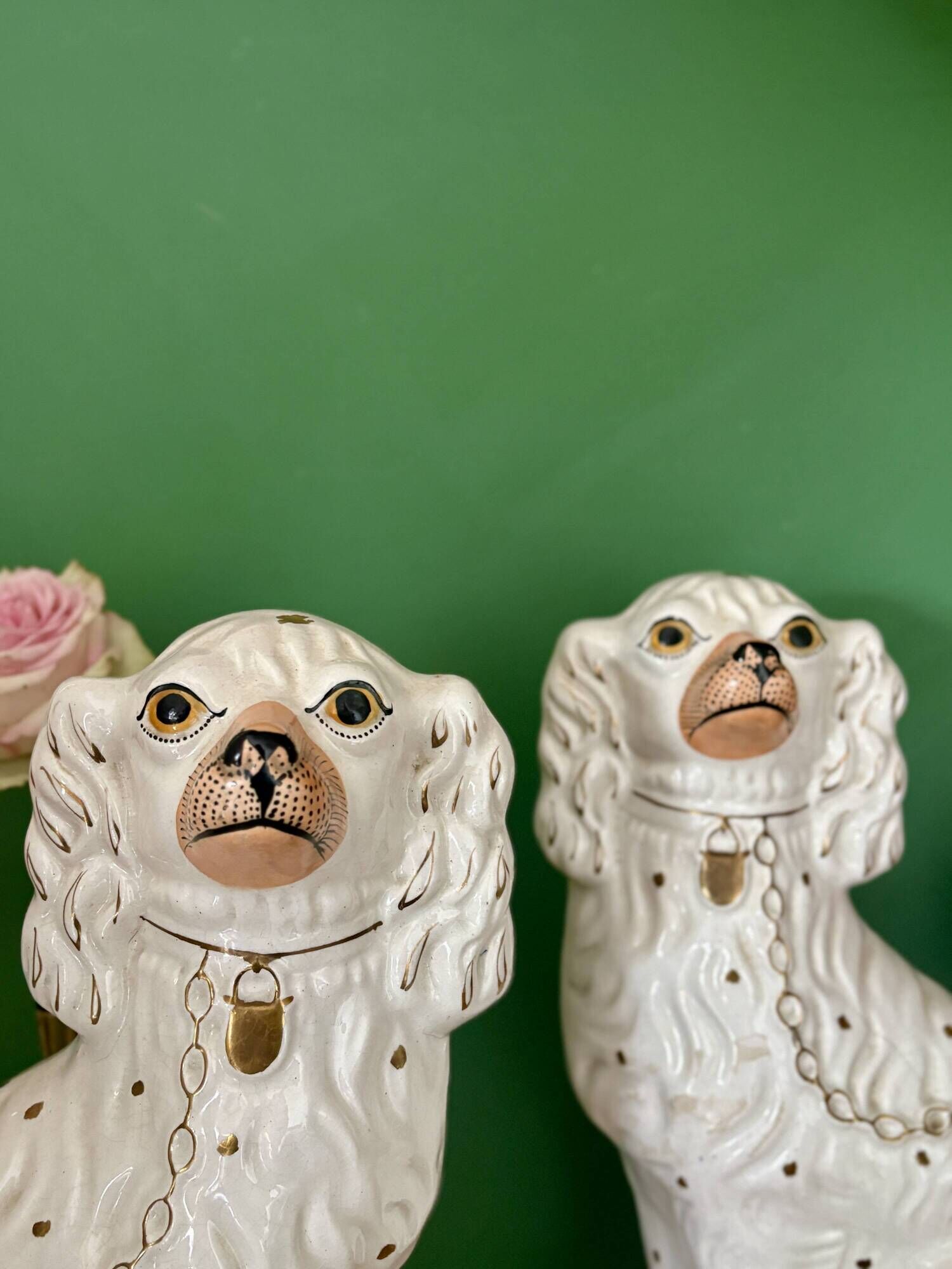 Pair of Staffordshire-type dogs in white and gold ceramic