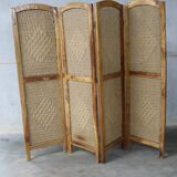 Handcrafted screen in exotic wood and rope.