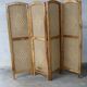 Handcrafted screen in exotic wood and rope.