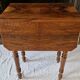 Nineteenth-century walnut work table with flaps, large storage + secret drawer.