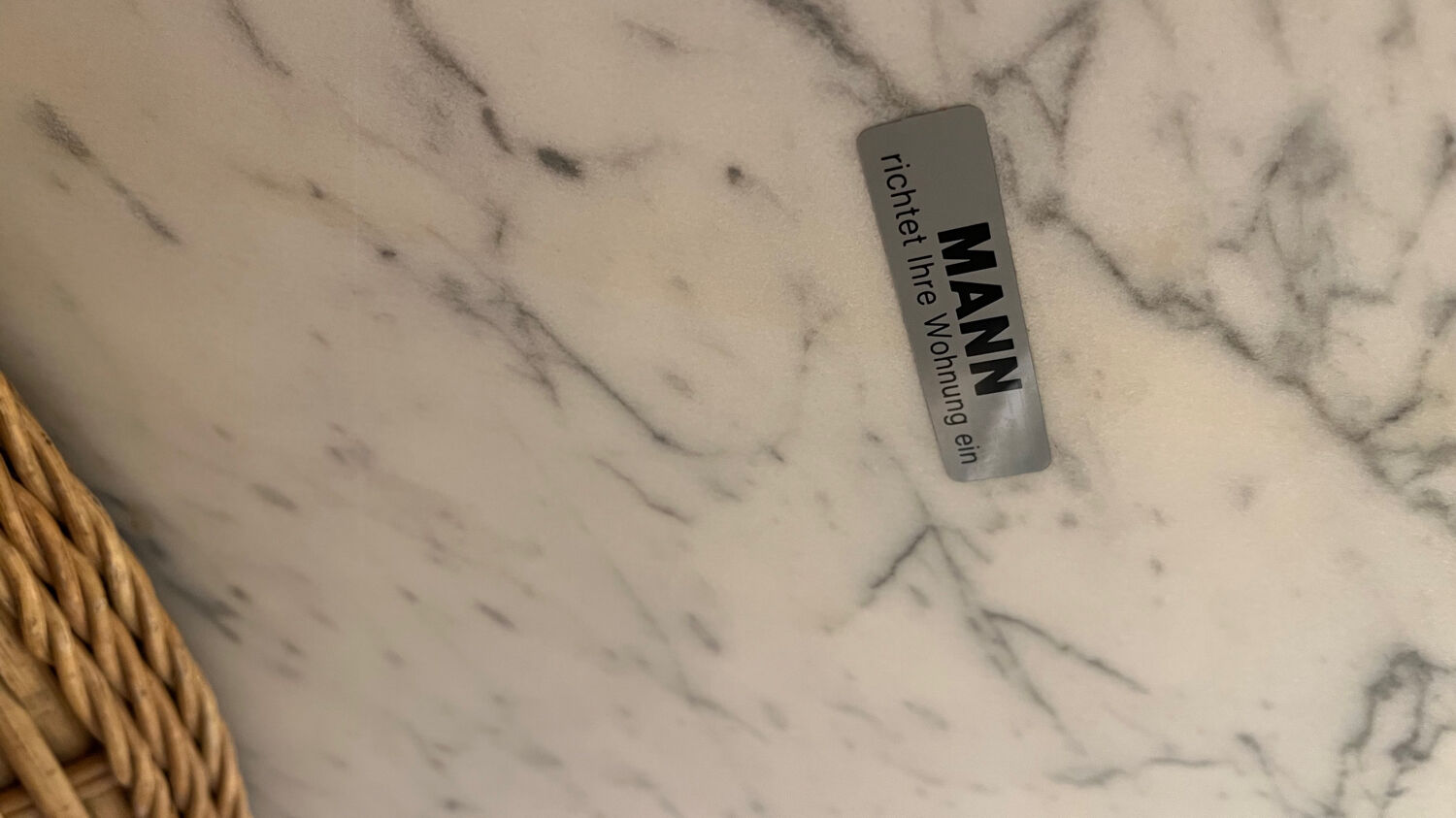 Marble and wicker dining table