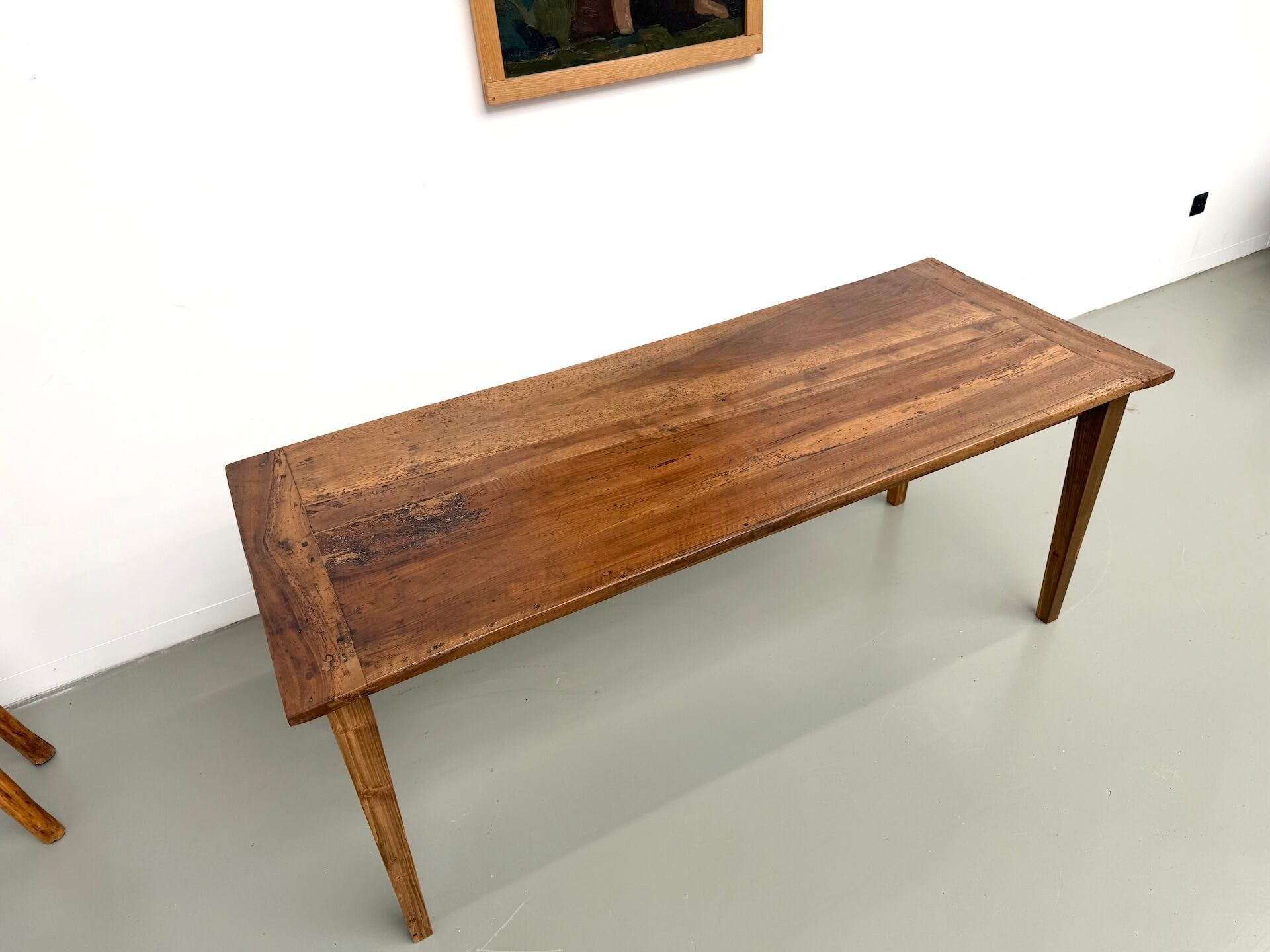 Farm table in walnut with spindle legs.