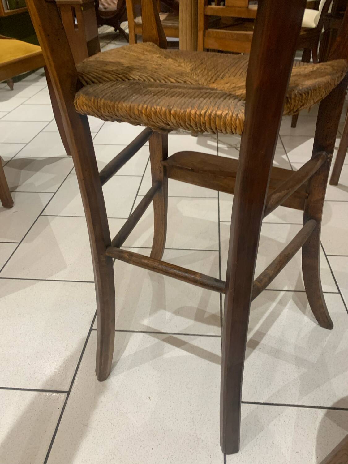 Antique straw-covered high chair
