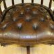 Restored Chesterfield captain's armchair in leather with an oak frame.