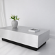 Table basse sculpturale flottante en aluminium brossé avec base noire