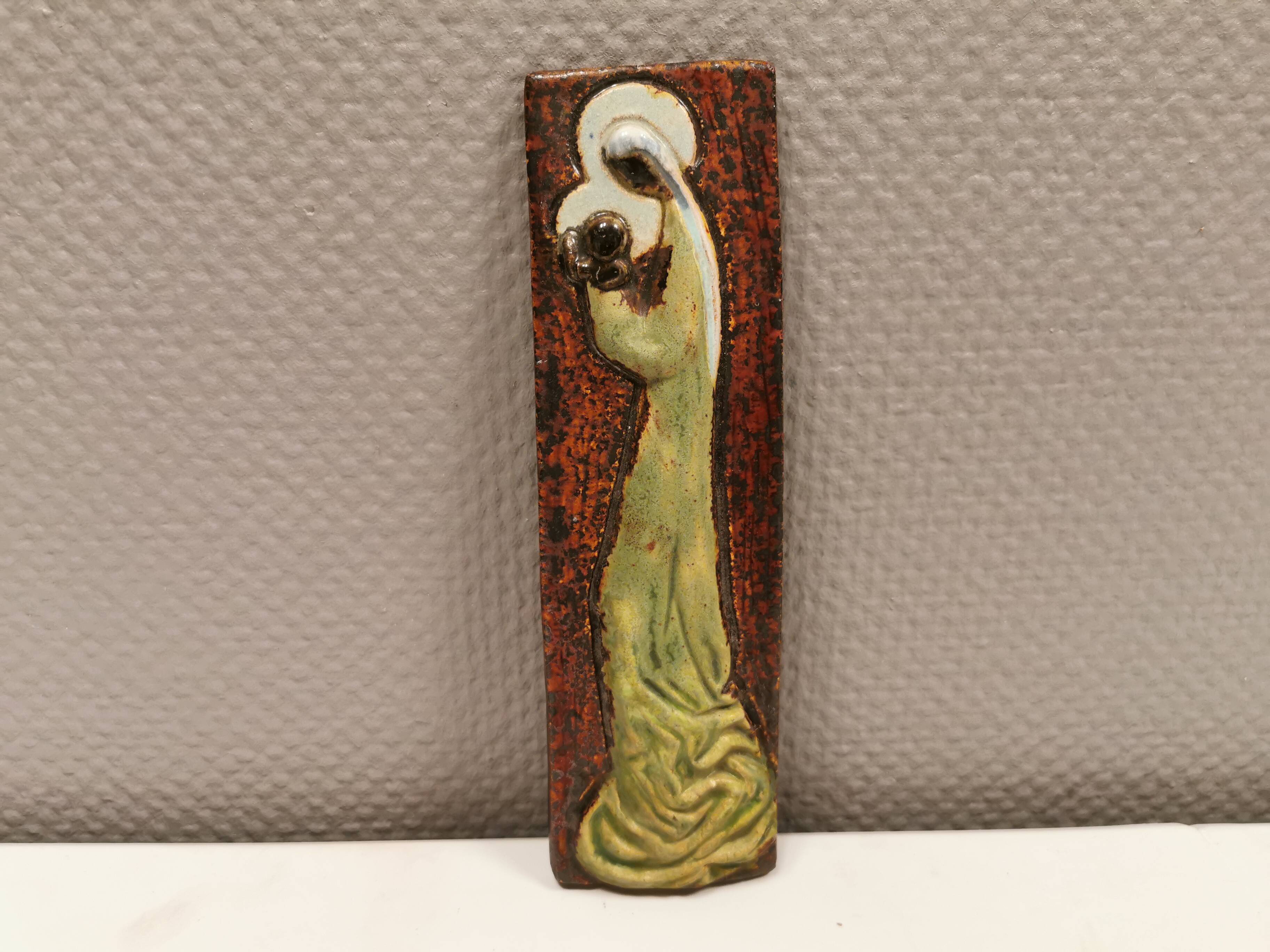 Slim relief with a motif of Madonna and child.