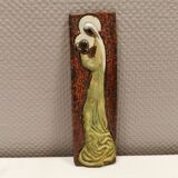 Slim relief with a motif of Madonna and child.