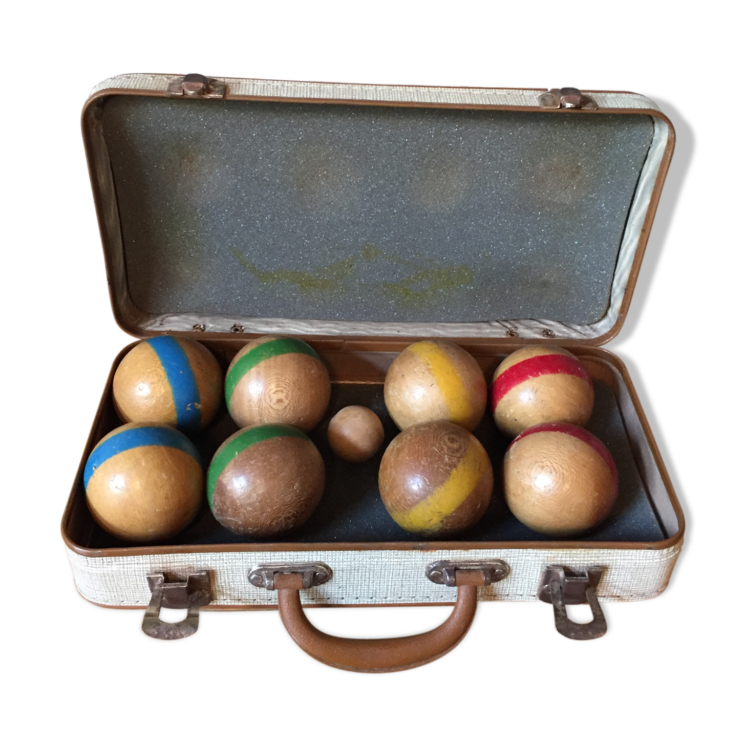 Old set of wooden balls in his suitcase
