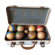 Old set of wooden balls in his suitcase