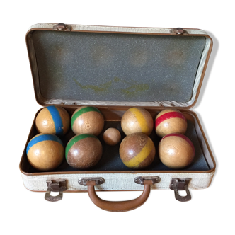 Old set of wooden balls in his suitcase