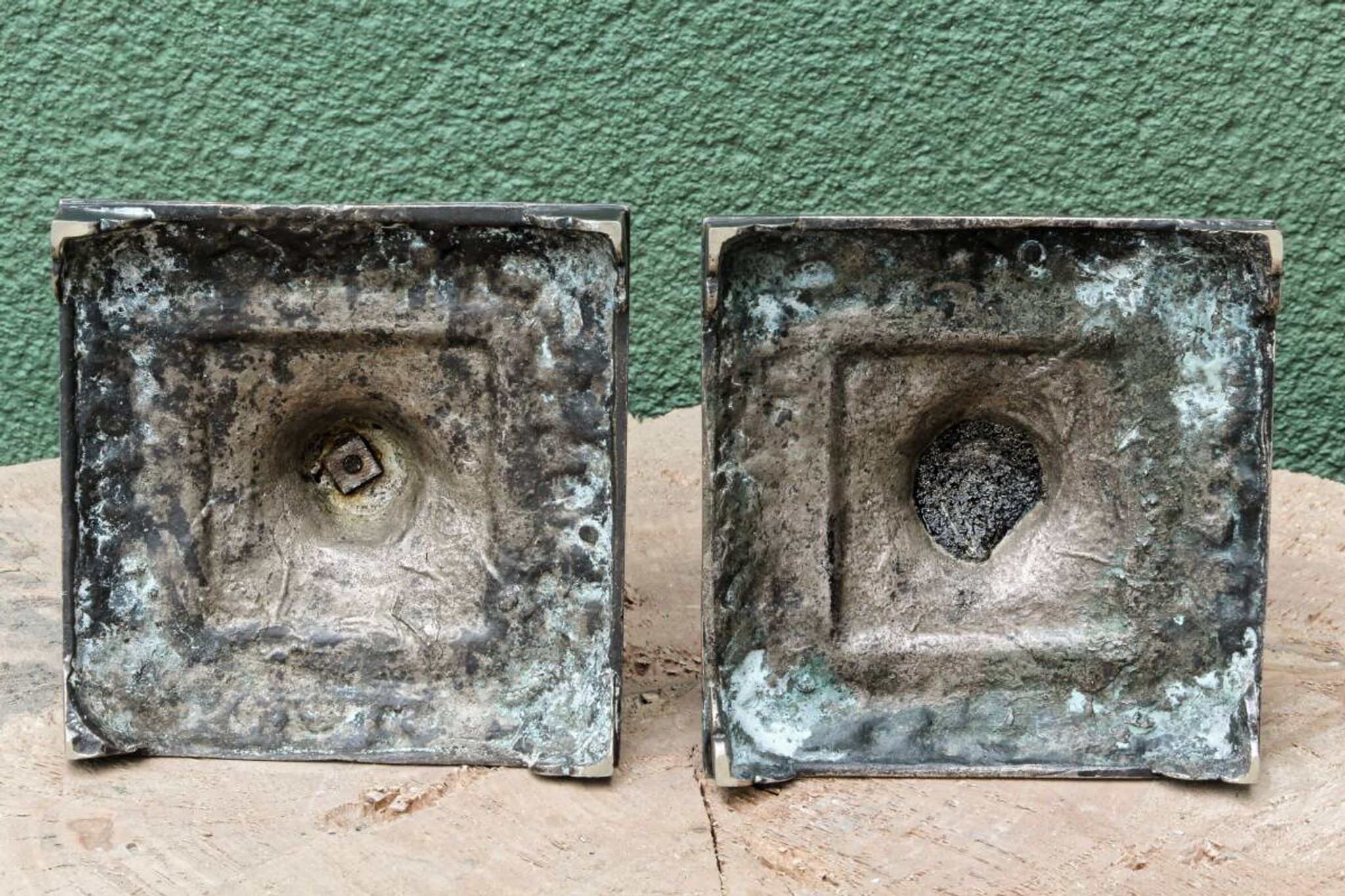 Pair of square candlesticks in patinated bronze