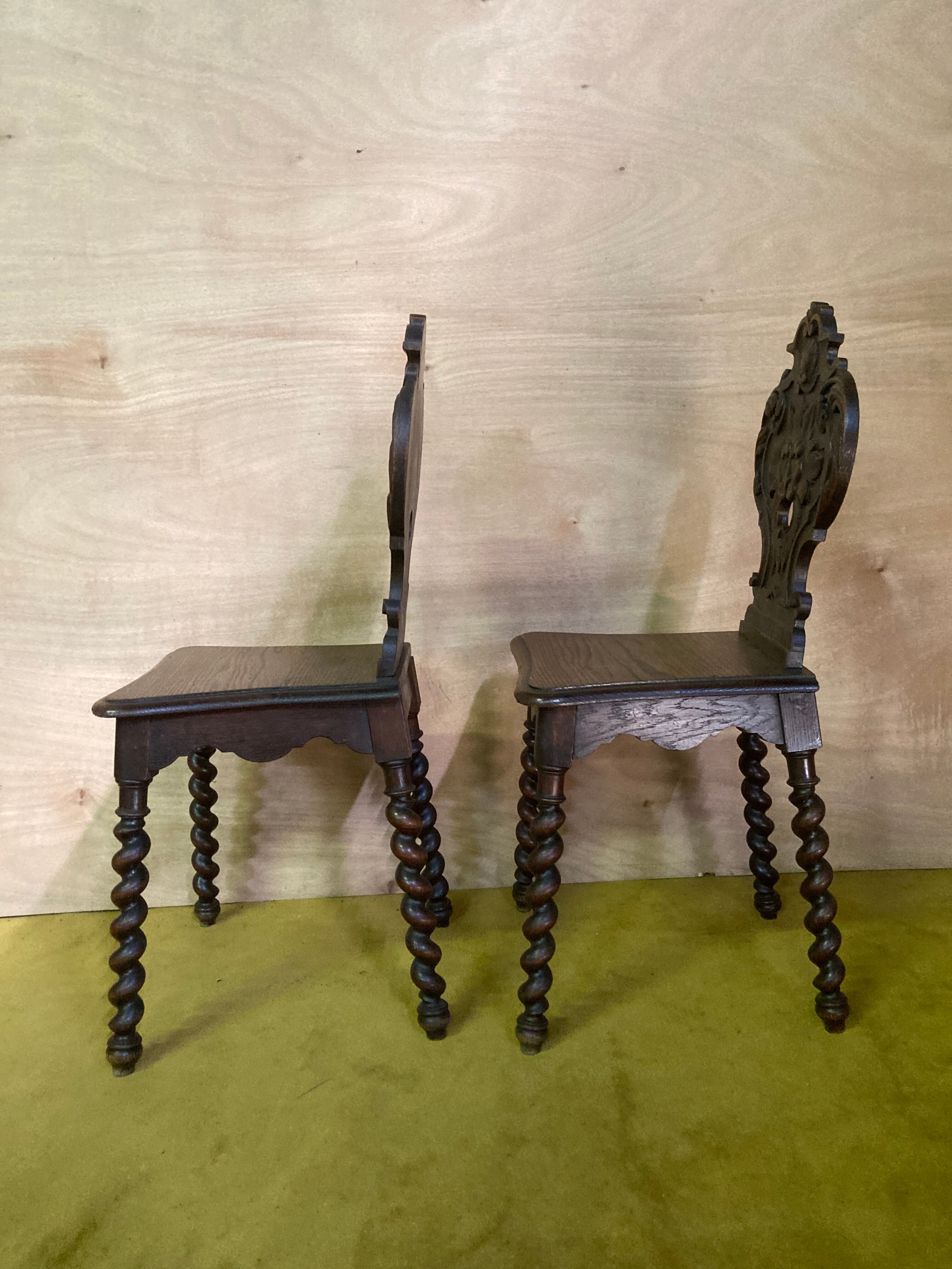 Duo of carved wooden chairs