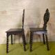 Duo of carved wooden chairs