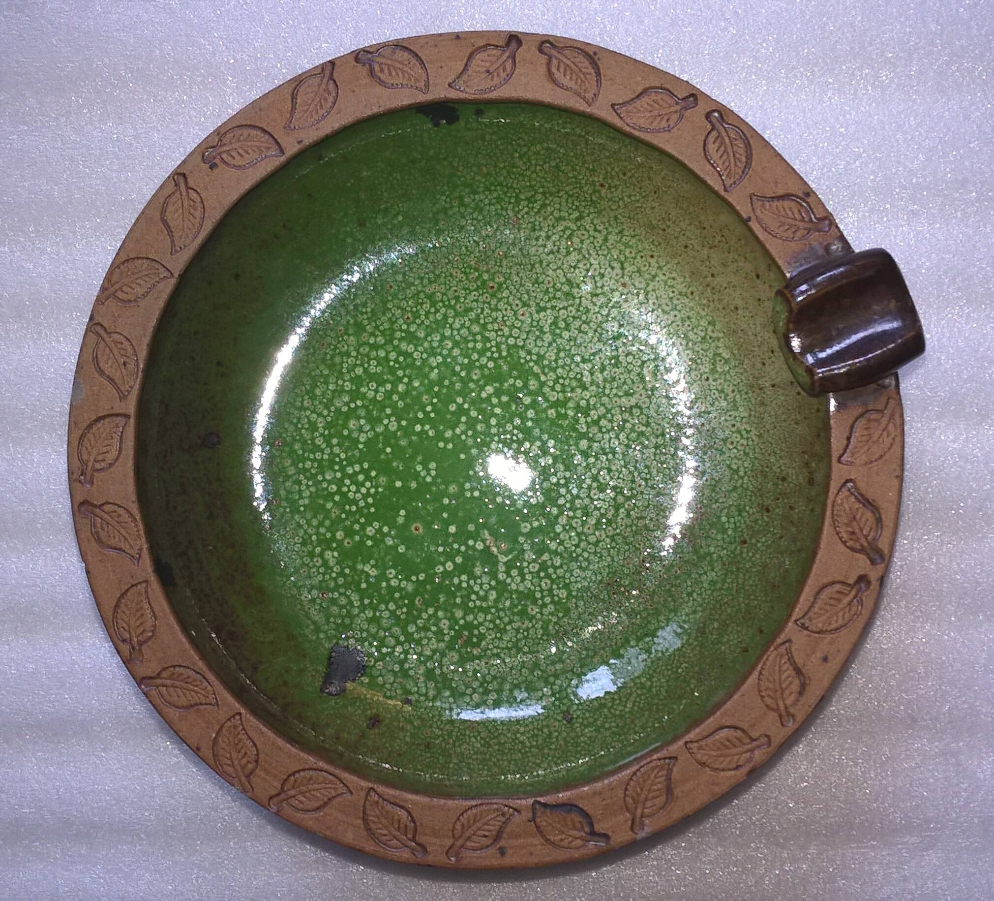 Vintage green enameled ceramic ashtray signed.