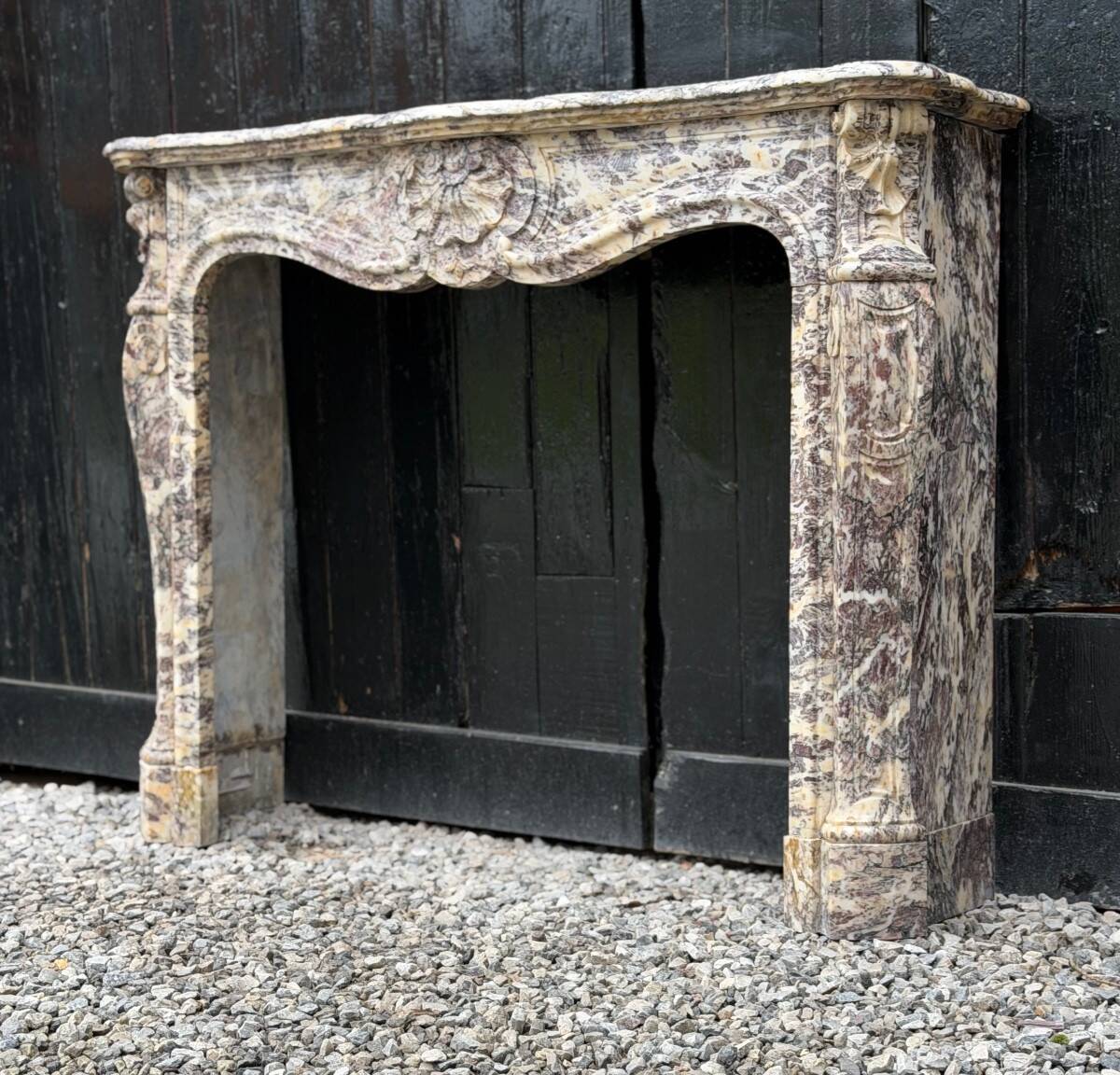 Louis XV style fireplace in Brocatelle marble, circa 1880.